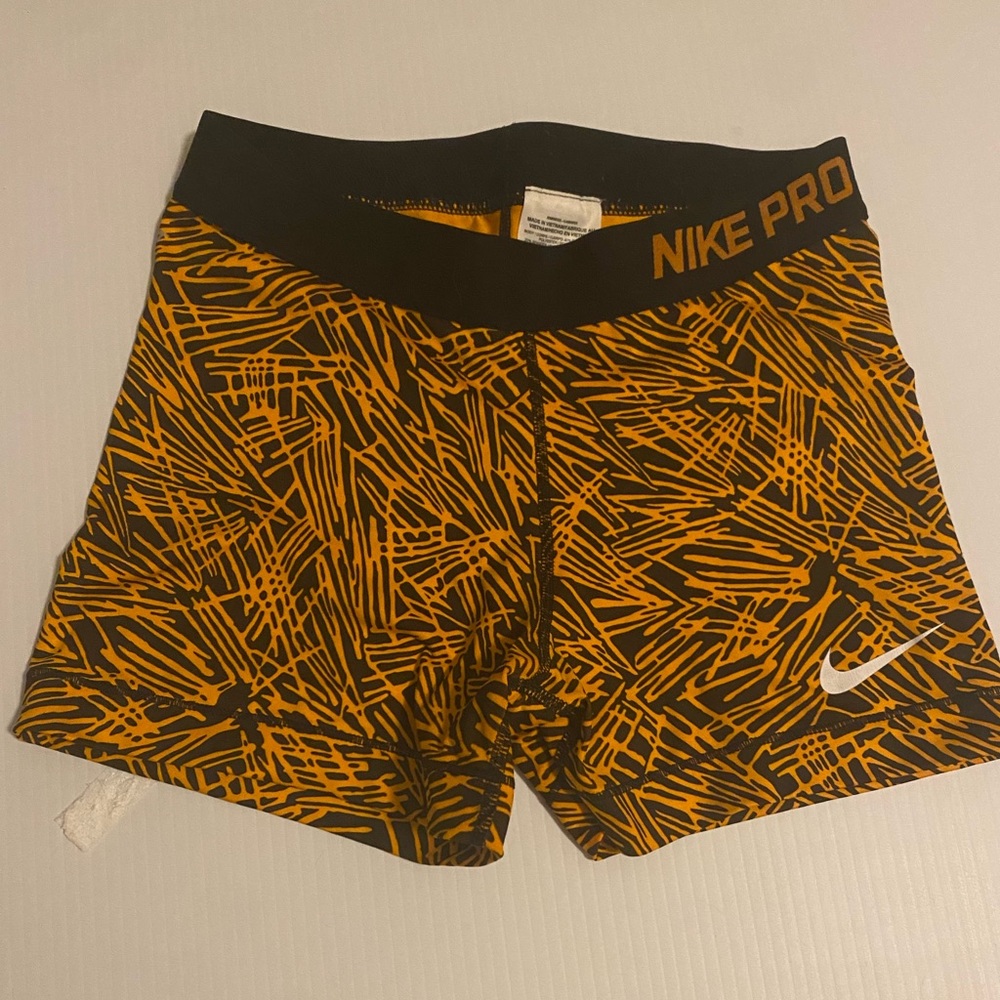 Orange and black Nike Pro spandex shorts